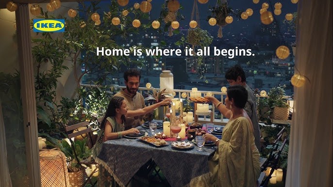 Photo of a family sat having dinner together round a table, with the words 'Home is where it all begins.'