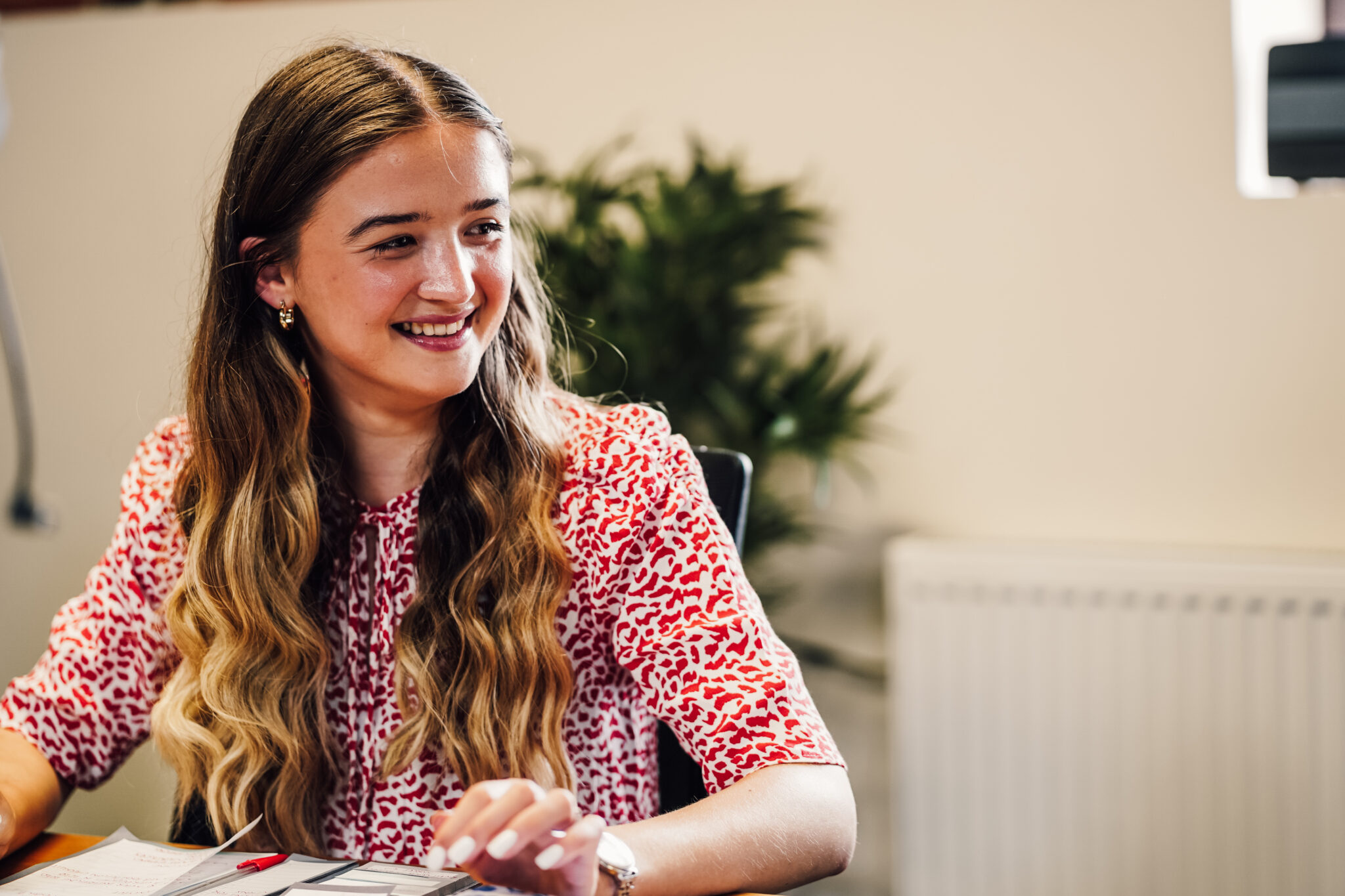 Marketing professional sat at her desk